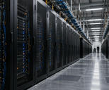 Synthetic editorial illustration. Unbranded high-density server racks and distant technician in an operational data-centre aisle.