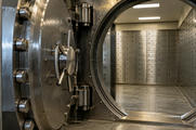 Synthetic editorial illustration. A bank vault interior. A thick circular steel door stands open, revealing rows of plain safe-deposit boxes with keyholes under simple overhead lights.