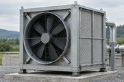 Synthetic editorial illustration. One large square industrial fan-and-filter module with modest pipework at an anonymous facility.