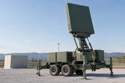 Synthetic editorial illustration. Generic mobile defensive air-surveillance radar apparatus in an anonymous test compound; no real named system, military unit, country, weapon use or combat incident.
