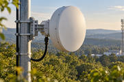 Synthetic editorial illustration. One plain telecommunications microwave dish is supported on a mast with a mounted bracket and routed cable.