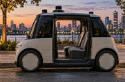 Synthetic editorial illustration. An urban curb. A compact silver cab stands with its side door open, revealing two seats and no visible steering wheel; roof sensors rise above the plain body against a softly lit dusk skyline.