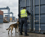 Synthetic editorial illustration. An anonymous customs inspection at a freight terminal with plain containers and a customs officer seen from behind checking a closed shipment, credible yard geometry, overcast daylight, no flags or markings.